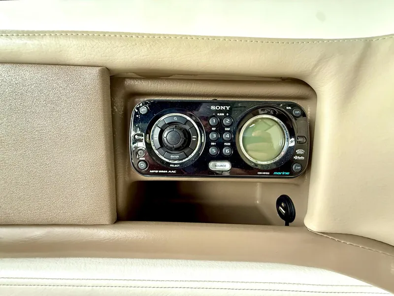 Slide: The Image of Sony marine audio system in 2013 Sea Ray 250 SLX boat dashboard. - 32