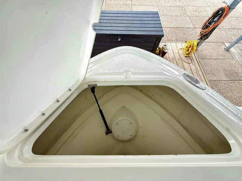 Slide: The Image of Open storage compartment on a 2013 Sea Ray 250 SLX boat. - 38