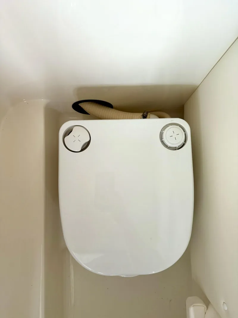 Slide: The Image of Marine toilet in a 2013 Sea Ray 250 SLX boat bathroom. - 41