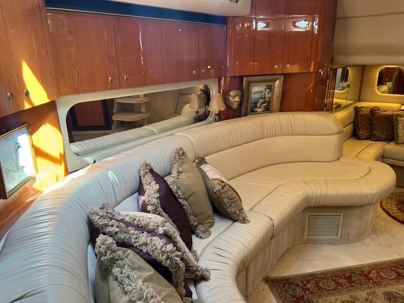 Slide: The Image of Luxurious interior of 2001 Sea Ray 380 Sundancer yacht with plush seating and elegant decor. - 19