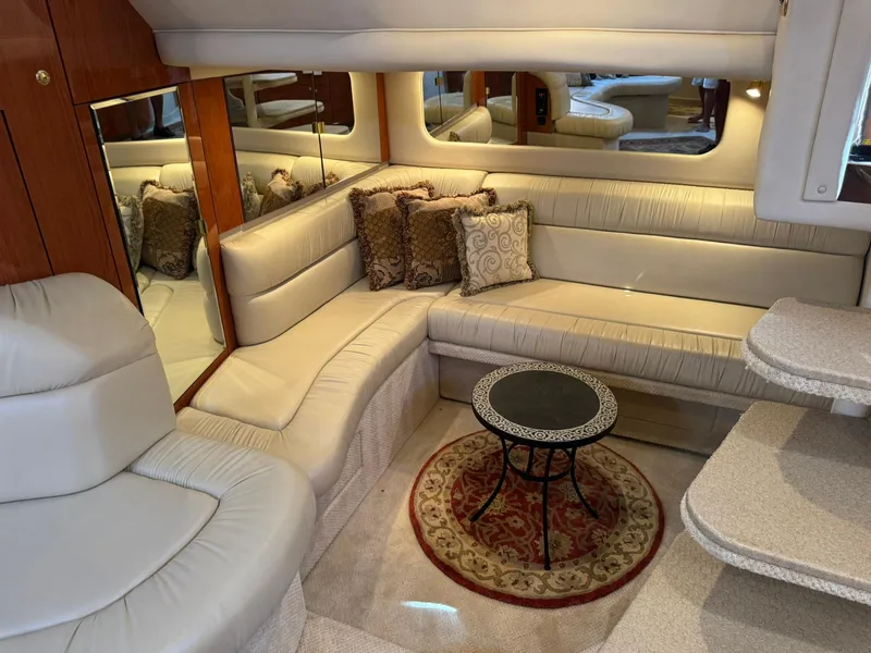 Slide: The Image of Luxurious interior of 2001 Sea Ray 380 Sundancer with plush seating and elegant decor. - 21