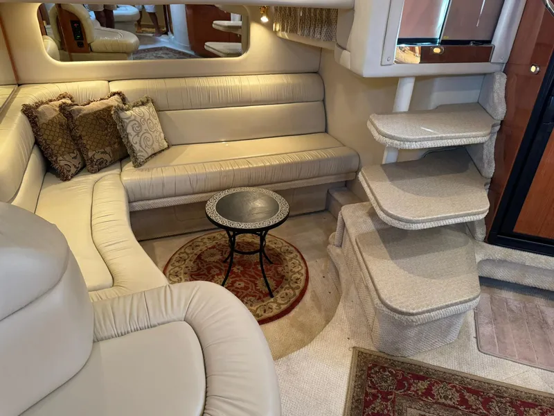 Slide: The Image of Luxurious interior of 2001 Sea Ray 380 Sundancer yacht with plush seating and elegant decor. - 22