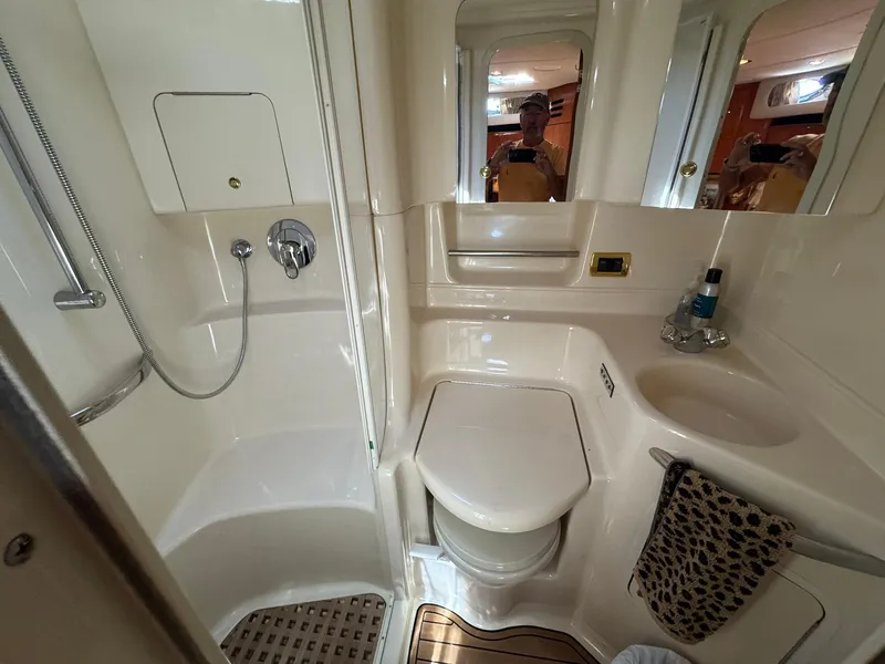 Slide: The Image of Bathroom interior of 2001 Sea Ray 380 Sundancer yacht, featuring shower and sink. - 32