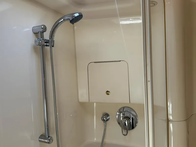 Slide: The Image of Shower area in 2001 Sea Ray 380 Sundancer yacht, featuring chrome fixtures. - 33