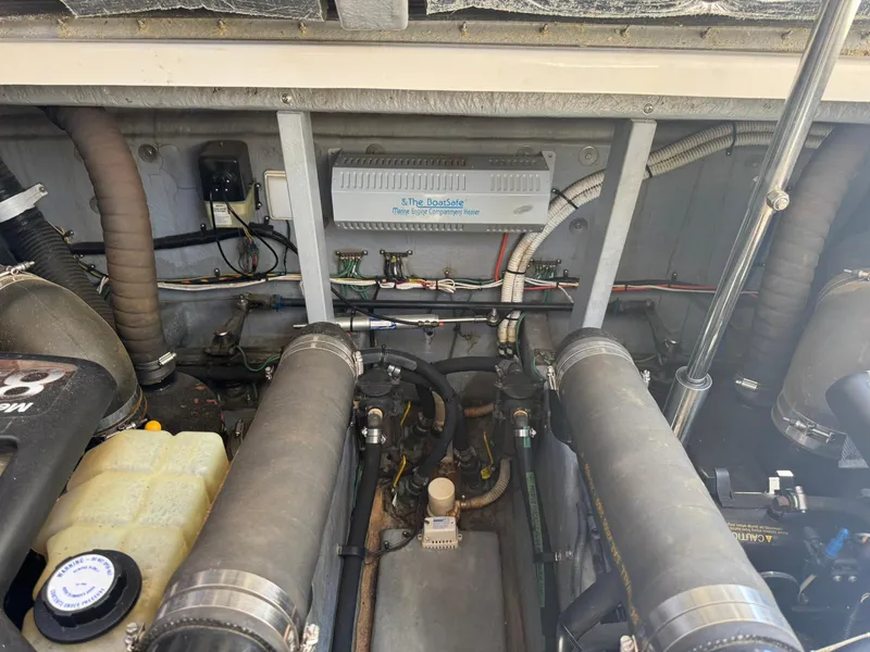 Slide: The Image of Engine room of a 2001 Sea Ray 380 Sundancer with visible components and wiring. - 38