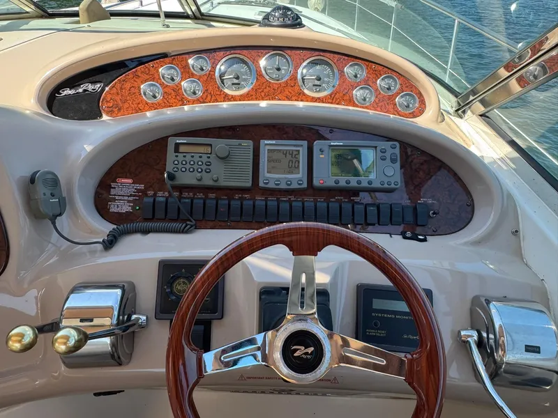 Slide: The Image of Control panel of a 2001 Sea Ray 380 Sundancer boat with gauges and navigation equipment. - 4