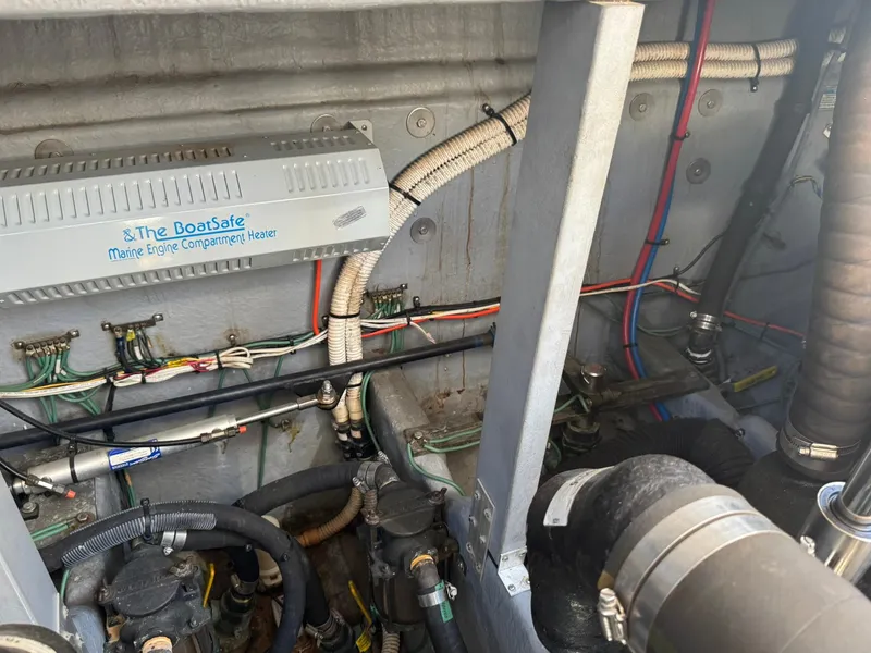 Slide: The Image of Engine compartment of 2001 Sea Ray 380 Sundancer with BoatSafe heater and wiring. - 43