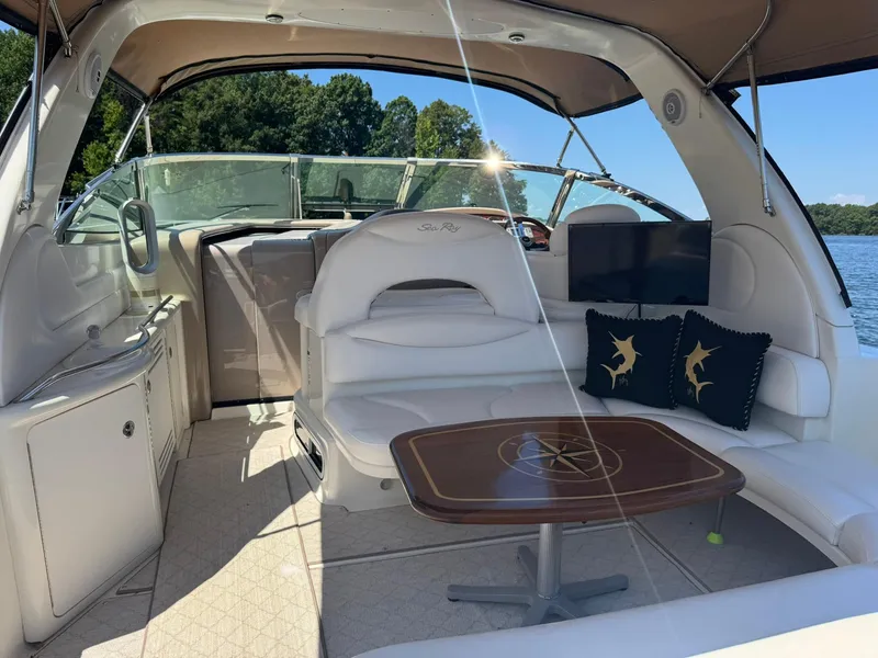 Slide: The Image of 2001 Sea Ray 380 Sundancer interior with seating, table, and lake view. - 7