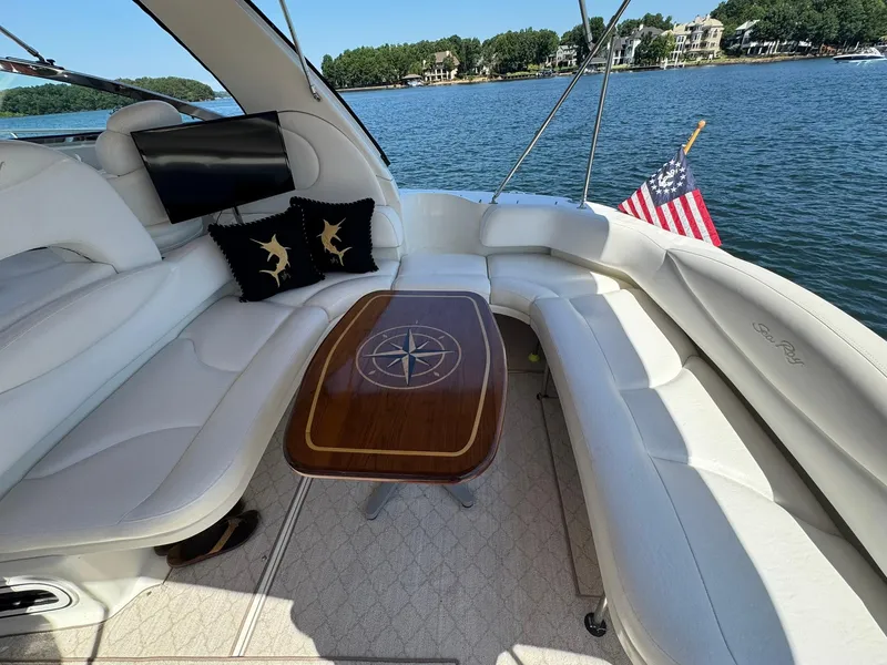 Slide: The Image of Luxurious 2001 Sea Ray 380 Sundancer yacht interior with elegant seating and nautical decor. - 8