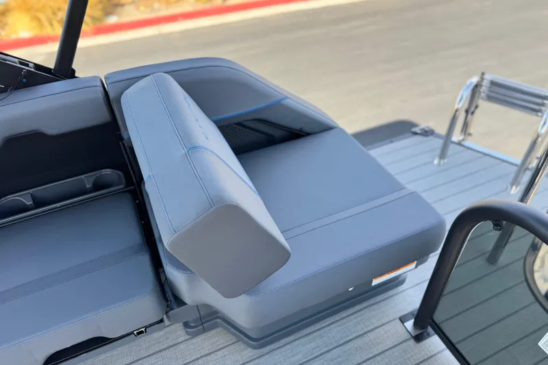 Slide: The Image of 2025 Manitou Explore 24 Navigator boat seating and deck detail. - 17