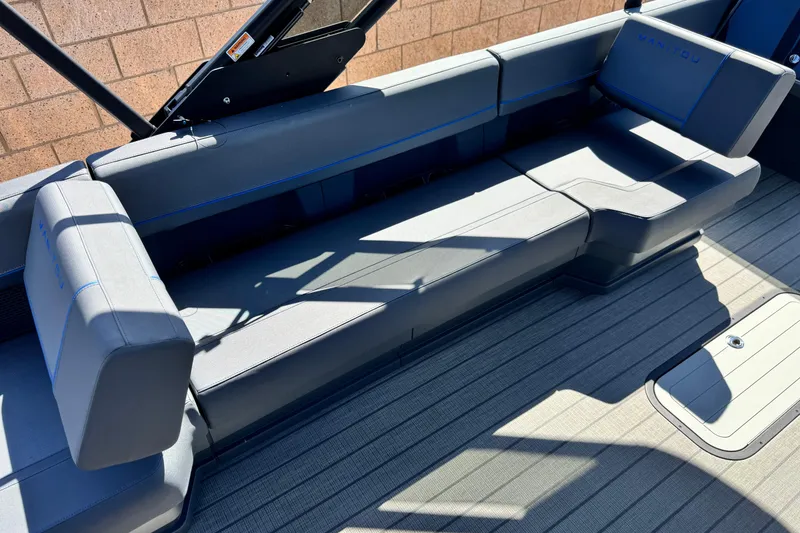 Slide: The Image of Luxurious seating on the 2025 Manitou Explore 24 Navigator boat, featuring sleek design and comfort. - 20