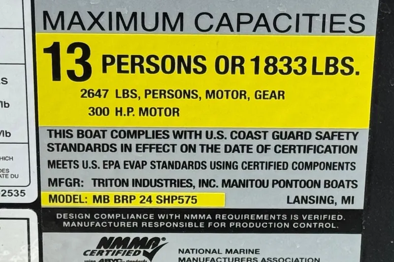 Slide: The Image of 2025 Manitou Explore 24 Navigator capacity label: 13 persons, 1833 lbs, 300 HP motor. - 29