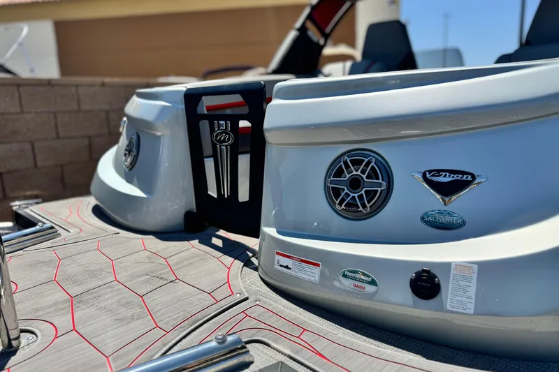 Slide: The Image of 2023 Manitou 25 XT RFXW boat with sleek design and modern features. - 10