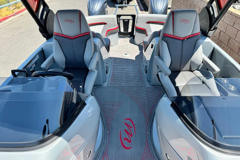 Slide: The Image of 2023 Manitou 25 XT RFXW boat interior with sleek seating and modern design. - 15
