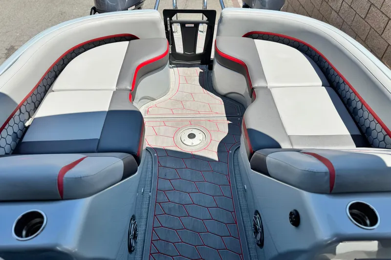 Slide: The Image of 2023 Manitou 25 XT RFXW boat interior with stylish seating and modern design. - 16