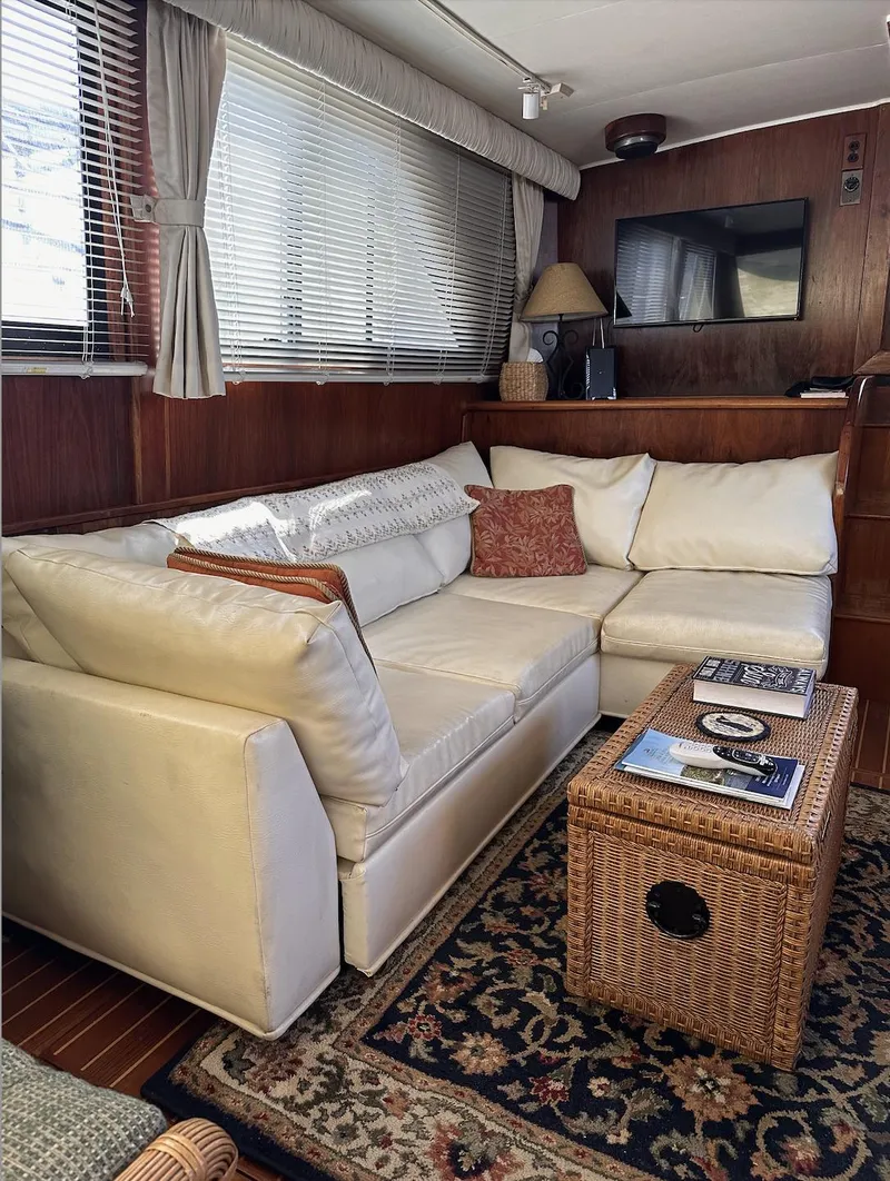 Slide: The Image of Luxurious interior of 1987 Californian 48 Cockpit Motor Yacht with cozy seating and elegant decor. - 12