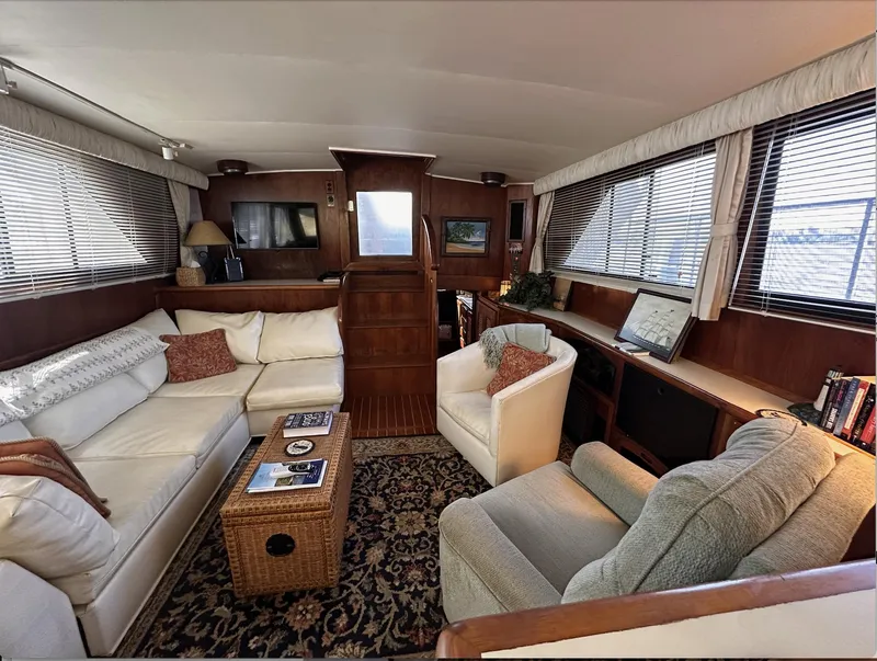 Slide: The Image of Luxurious interior of 1987 Californian 48 Cockpit Motor Yacht with cozy seating and elegant decor. - 17