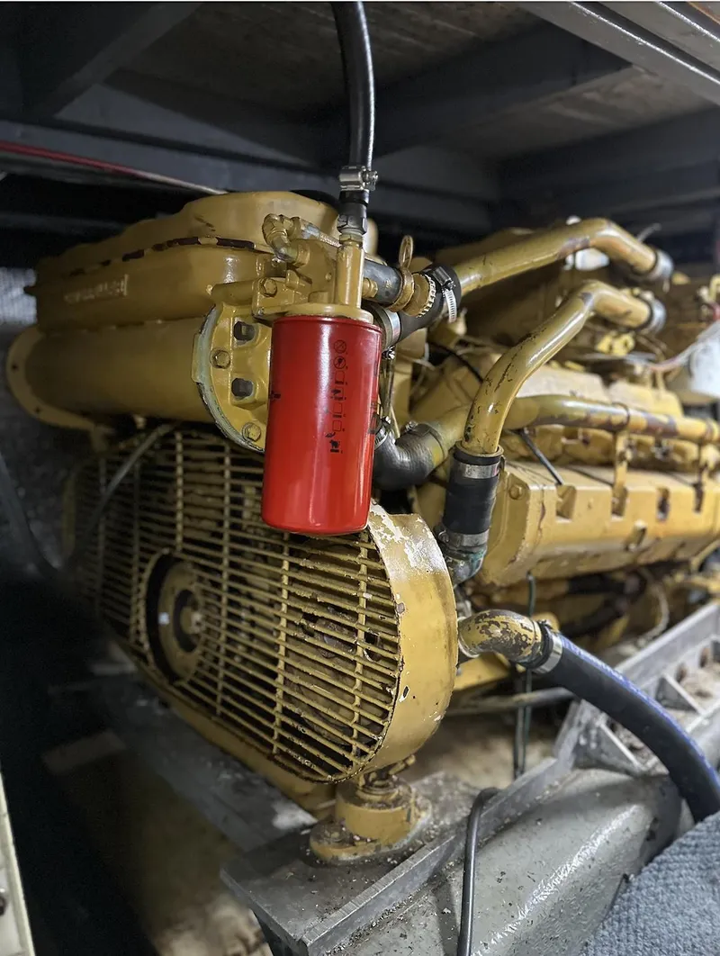Slide: The Image of Engine of 1987 Californian 48 Cockpit Motor Yacht with red filter and yellow components. - 18