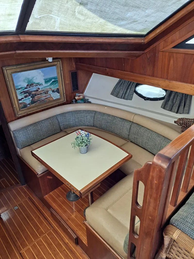 Slide: The Image of Interior of 1987 Californian 48 Cockpit Motor Yacht with cozy seating and nautical decor. - 4