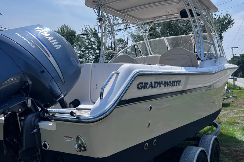 Slide: The Image of 2012 Grady-White Freedom 275 boat with Yamaha outboard motor, parked on a trailer. - 20