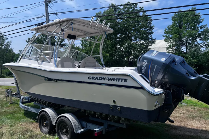 Slide: The Image of 2012 Grady-White Freedom 275 boat on trailer with Yamaha outboard motor. - 22
