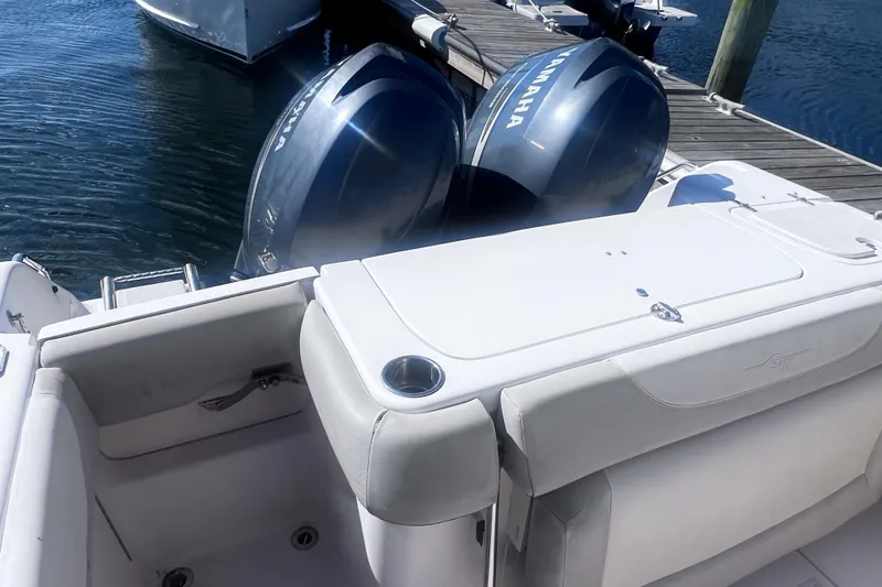 Slide: The Image of 2012 Grady-White Freedom 275 boat with dual Yamaha outboard engines at dock. - 24