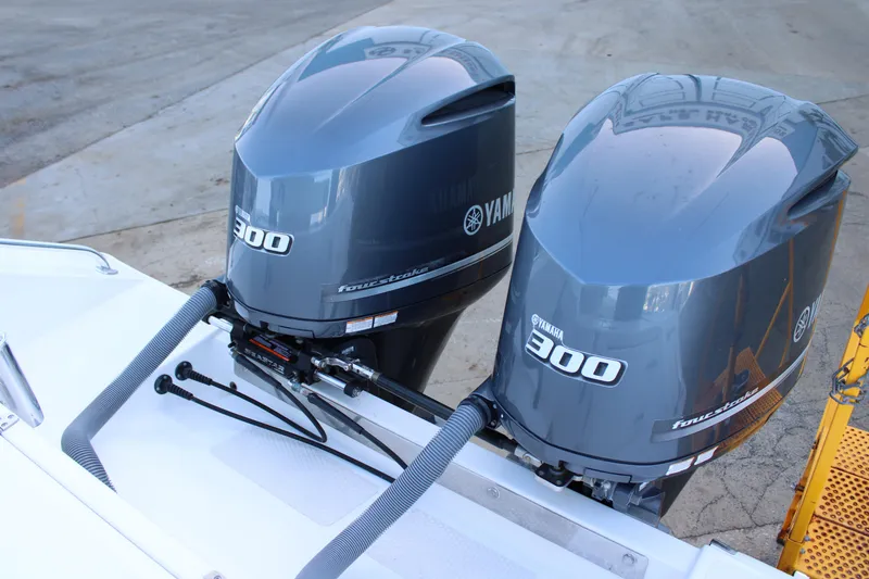 Slide: The Image of Twin Yamaha 300 outboard engines on a 1998 Venture 34 Open boat. - 10