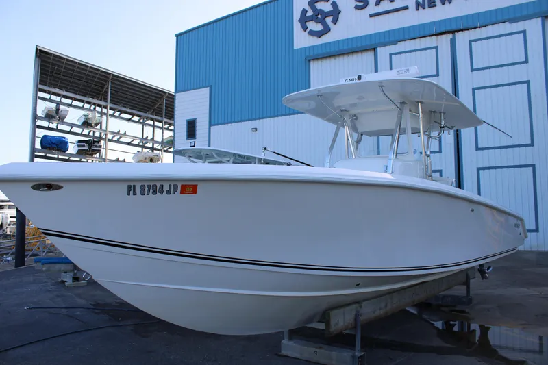 Slide: The Image of 1998 Venture 34 Open boat on display at a marina. - 2