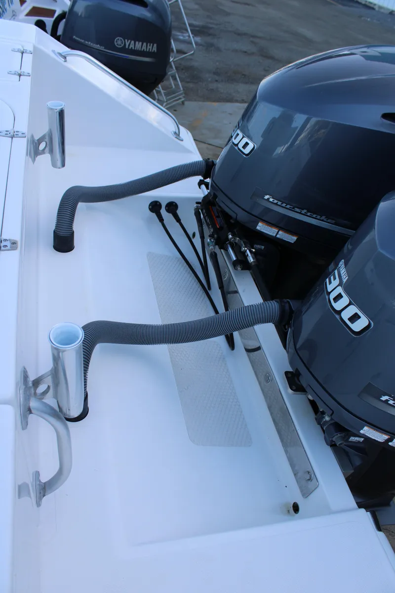 Slide: The Image of 1998 Venture 34 Open boat with Yamaha outboard engines and fishing rod holders. - 38
