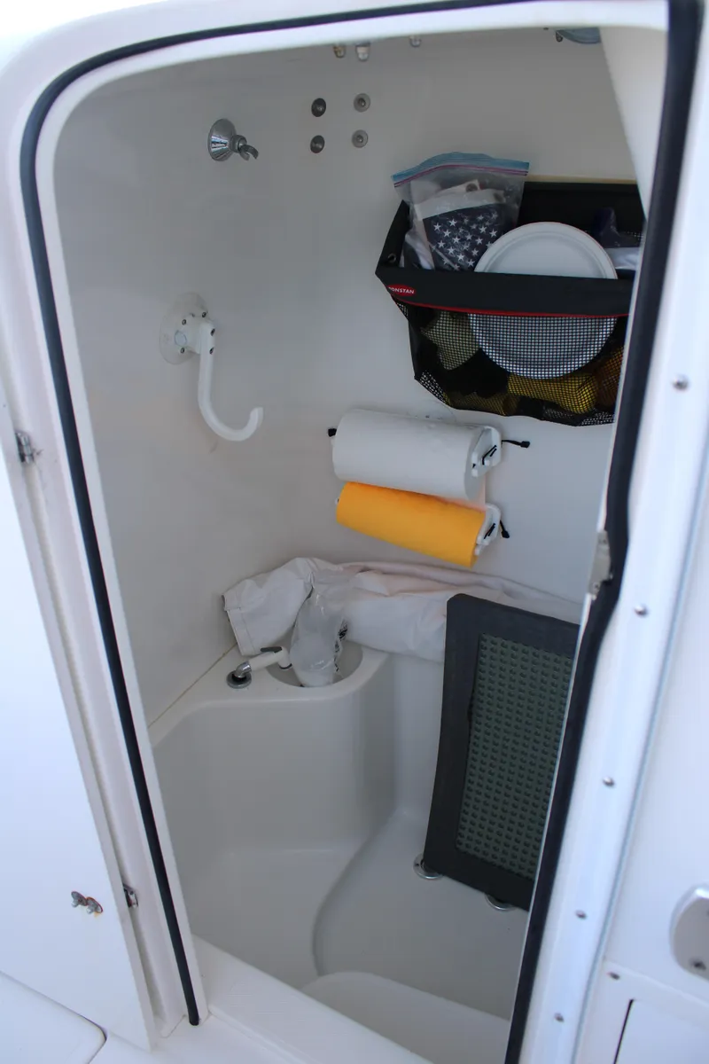 Slide: The Image of Compact bathroom in 1998 Venture 34 Open boat with storage and sink. - 39