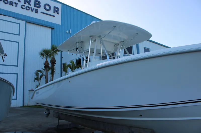 Slide: The Image of 1998 Venture 34 Open boat docked at Harbor Port Cove, side view. - 6
