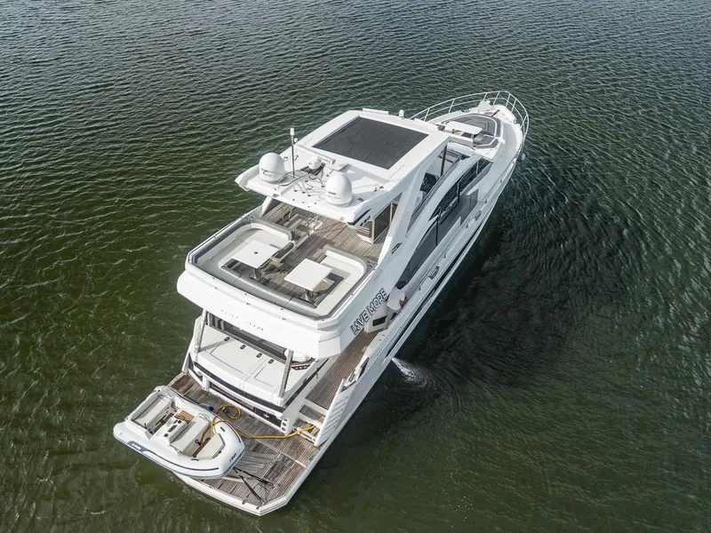 Slide: The Image of Aerial view of 2021 Galeon 680 Fly yacht cruising on water. - 30
