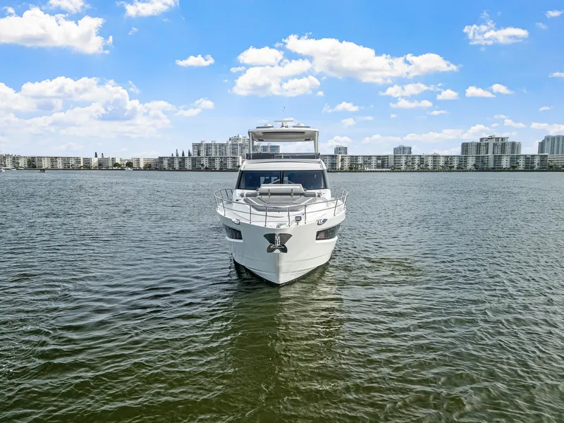 Slide: The Image of 2021 Galeon 680 Fly yacht on water with cityscape background. - 39