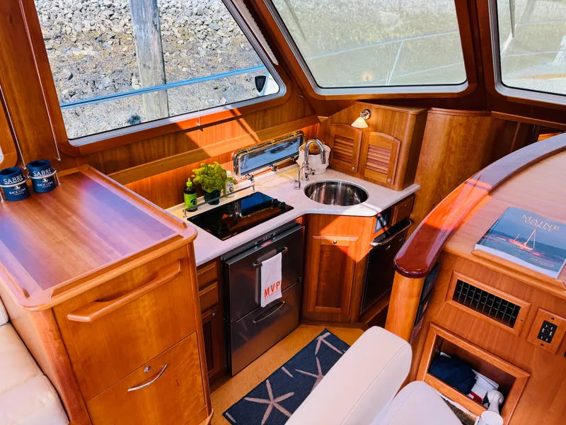 Slide: The Image of Luxurious 2018 Sabre 42 Salon Express yacht interior with elegant wood finish and modern amenities. - 12