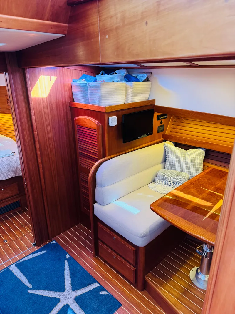 Slide: The Image of 2018 Sabre 42 Salon Express interior with cozy seating and wooden finishes. - 17