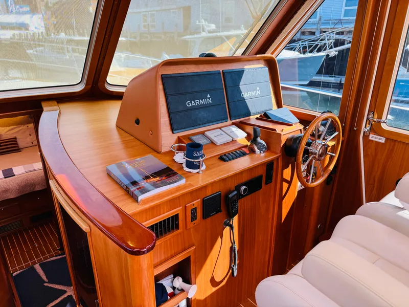 Slide: The Image of 2018 Sabre 42 Salon Express helm with Garmin displays and wooden interior. - 29