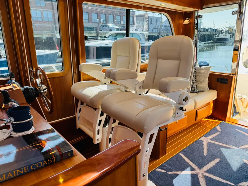 Slide: The Image of Interior of 2018 Sabre 42 Salon Express yacht with plush seating and wooden accents. - 31