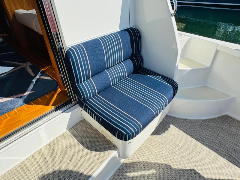 Slide: The Image of Blue striped seating on 2018 Sabre 42 Salon Express yacht, near cabin entrance. - 34