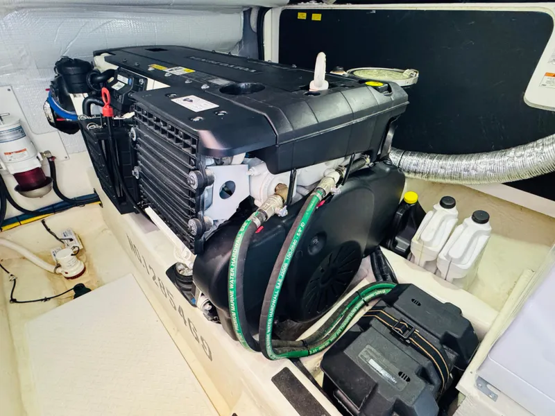 Slide: The Image of Engine room of 2018 Sabre 42 Salon Express with visible components and wiring. - 38