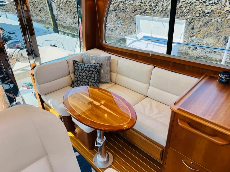Slide: The Image of Luxurious interior of 2018 Sabre 42 Salon Express yacht with elegant seating and wooden table. - 4
