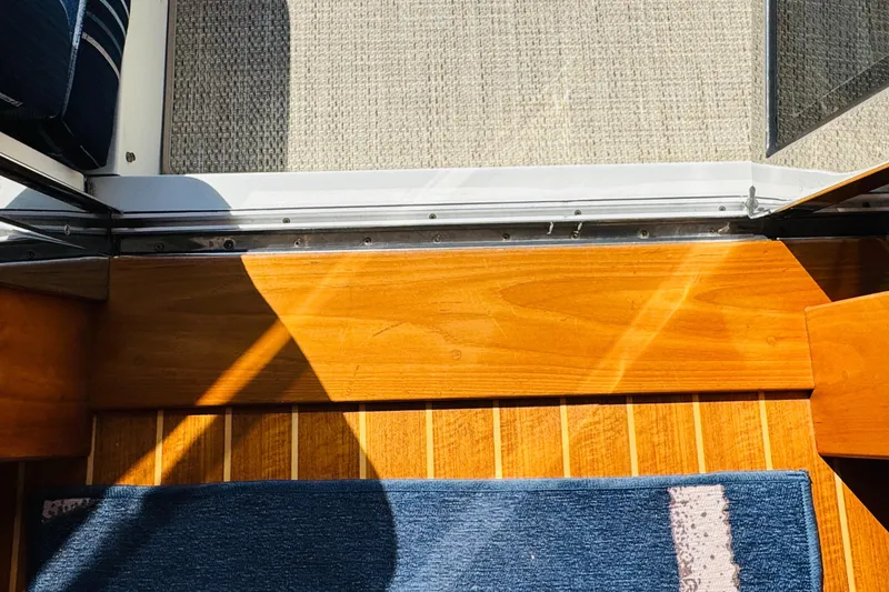 Slide: The Image of Interior view of 2018 Sabre 42 Salon Express with wooden flooring and blue rug. - 47