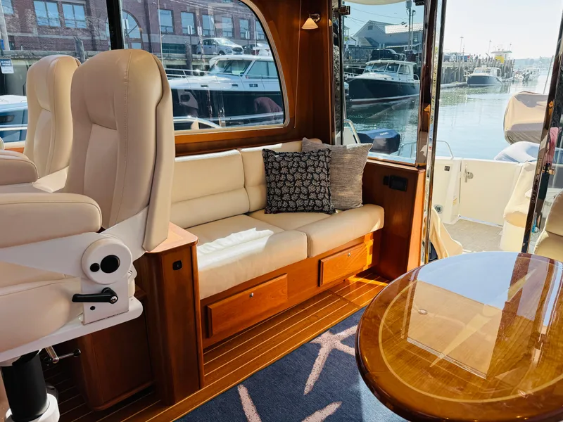 Slide: The Image of Interior of 2018 Sabre 42 Salon Express yacht with plush seating and elegant wood finishes. - 6