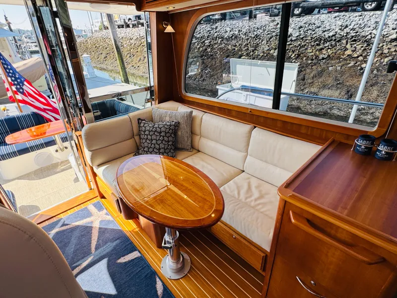 Slide: The Image of Interior of 2018 Sabre 42 Salon Express yacht with elegant seating and wooden table. - 7