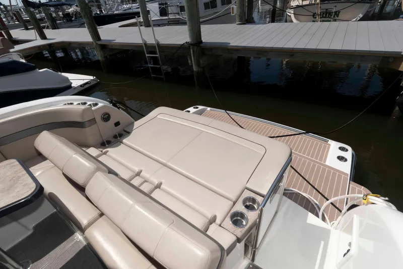 Slide: The Image of 2018 Formula 34 PC yacht with spacious seating and swim platform at marina. - 11