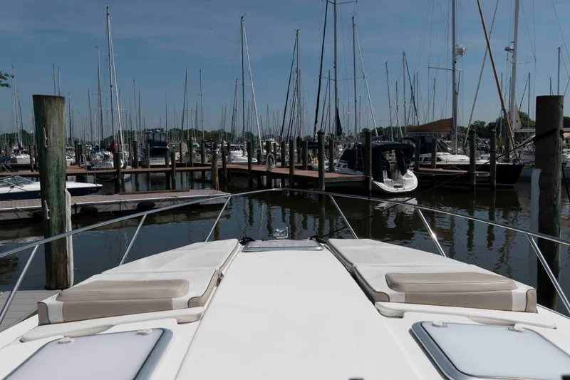 Slide: The Image of 2018 Formula 34 PC yacht docked in a marina with sailboats. - 12