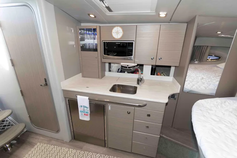 Slide: The Image of Modern kitchen interior of 2018 Formula 34 PC yacht with sleek cabinetry and appliances. - 15