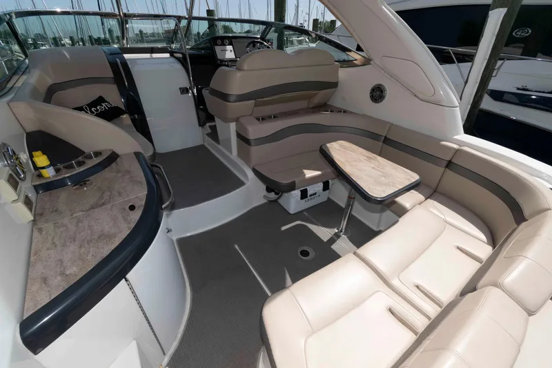 Slide: The Image of 2018 Formula 34 PC yacht interior with beige seating and compact table. - 3