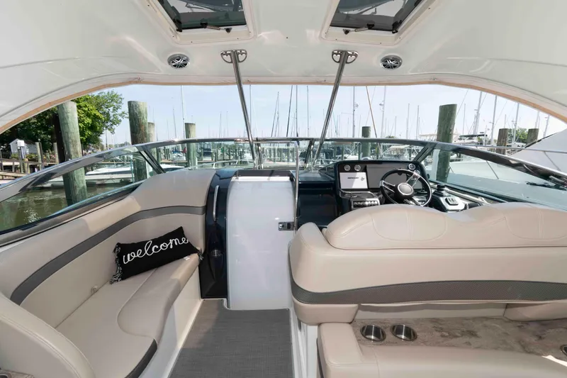 Slide: The Image of 2018 Formula 34 PC yacht interior with plush seating and modern dashboard. - 5