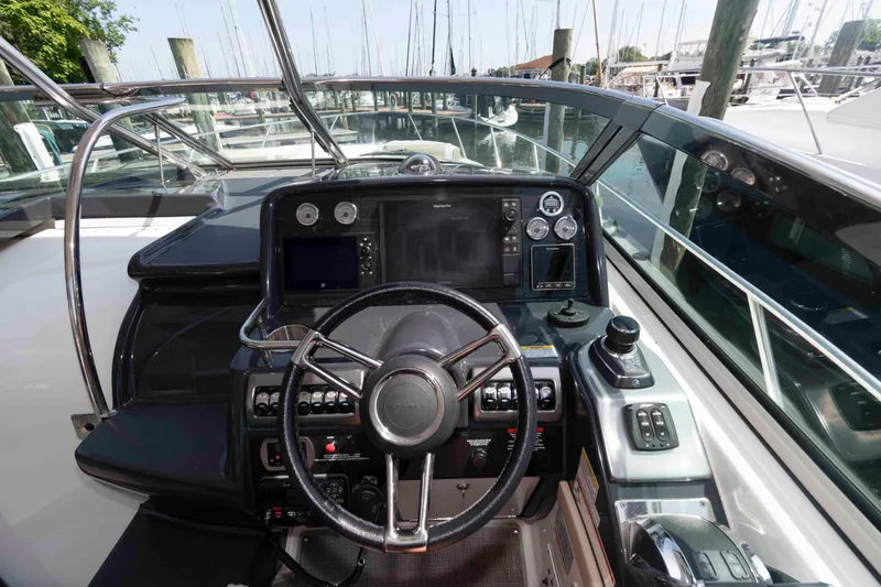 Slide: The Image of 2018 Formula 34 PC yacht helm with modern controls and navigation system. - 6