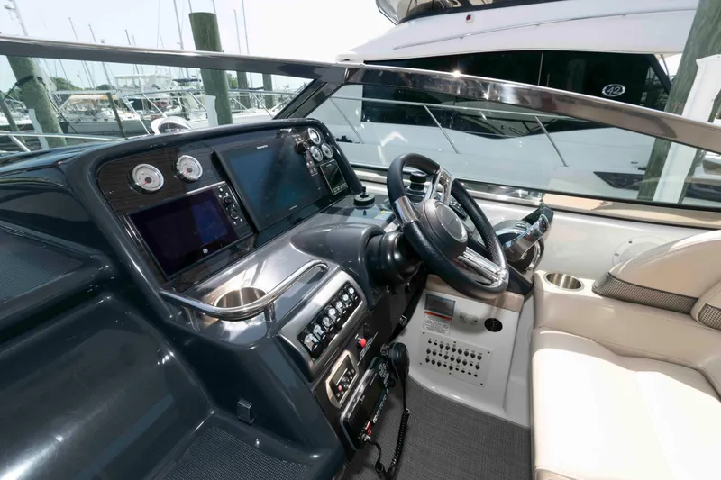 Slide: The Image of 2018 Formula 34 PC yacht cockpit with modern navigation controls and luxurious seating. - 8
